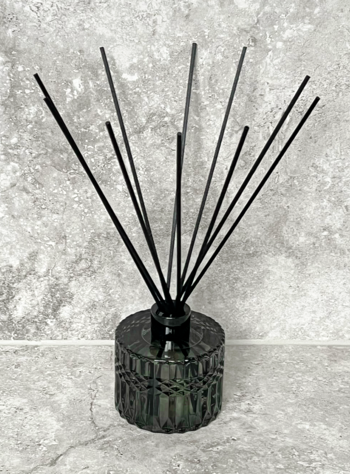 Smokey green diffuser with black reeds